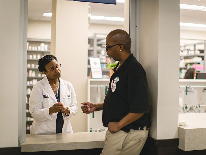 Shantelle Brown counseling a patient at HOPE Pharmacy