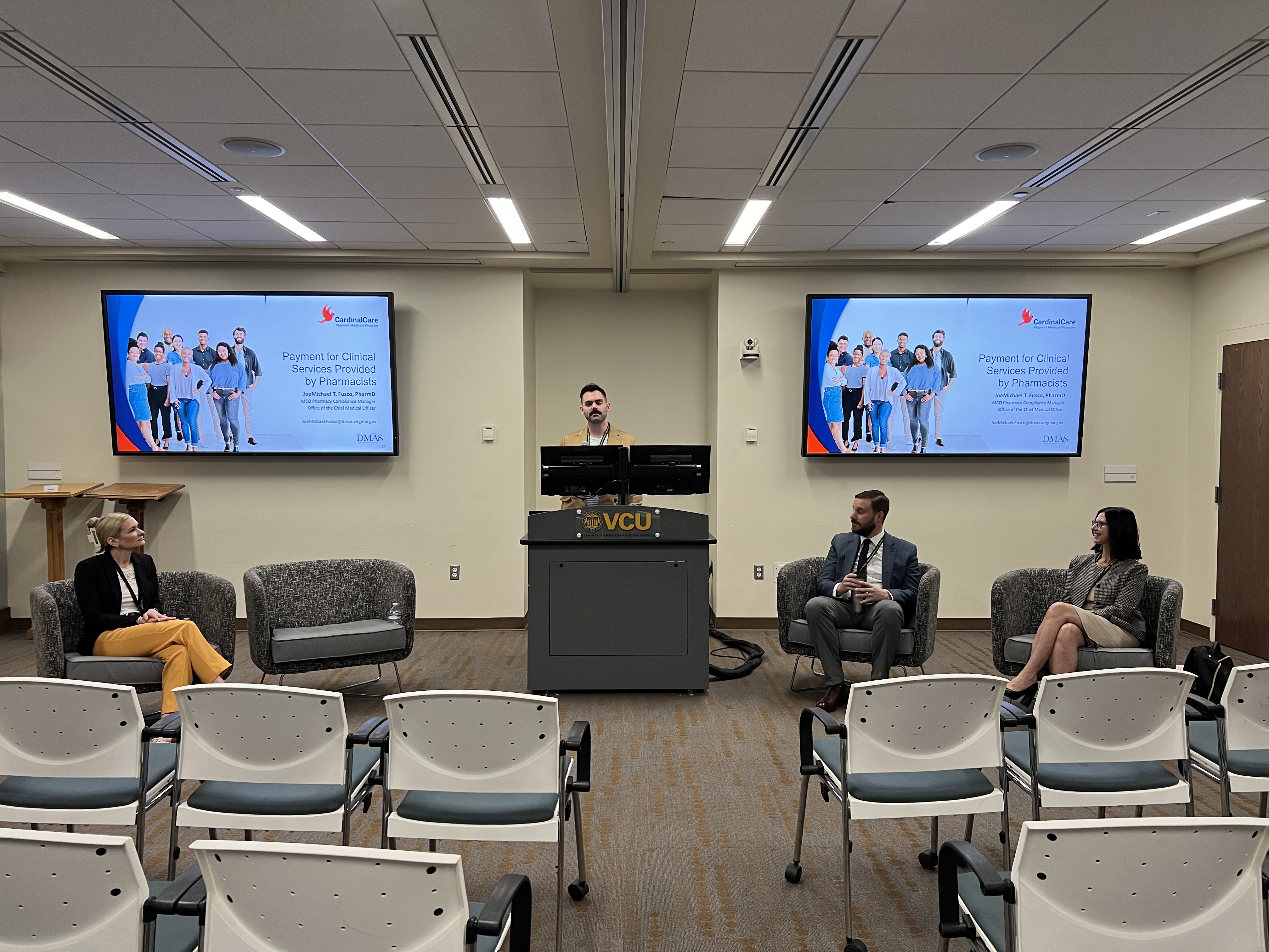 Picture of JoeMichael Fusco presenting along with panelists, Tana Kaefer, , Sharon Gatewood, John Bucheit, Caroline Juran.