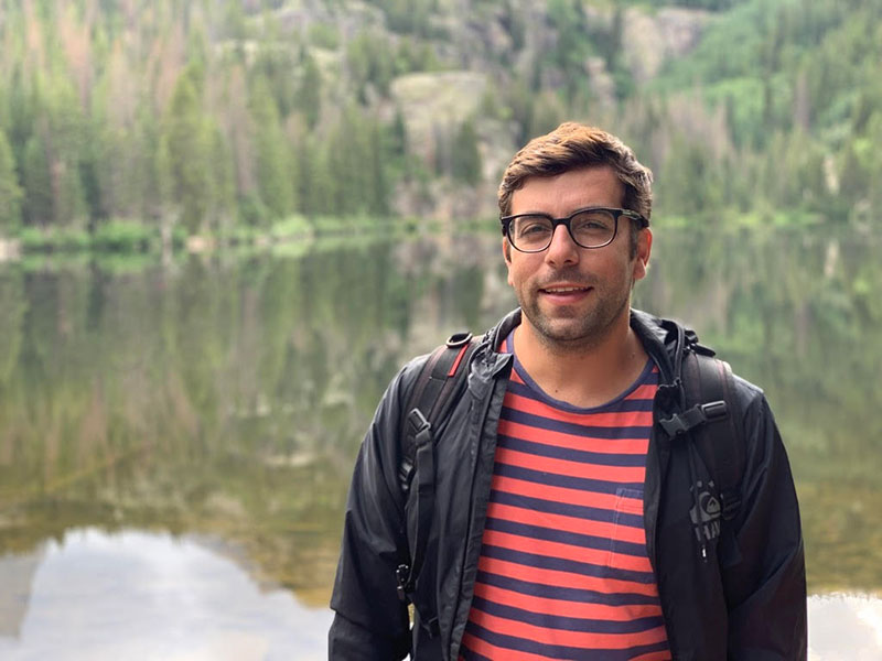 Vasco Pontinha standing in front of a lake