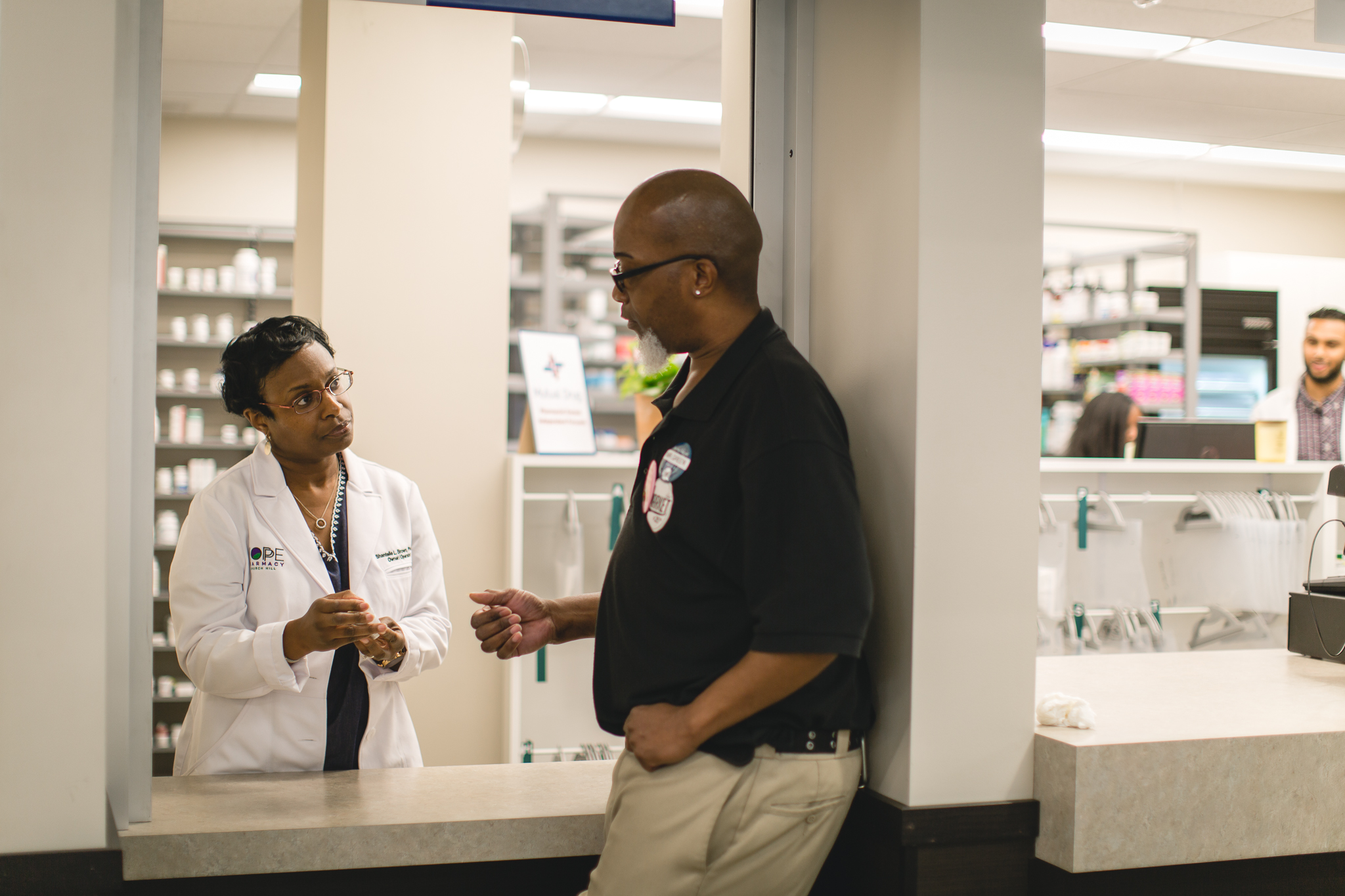 Shantelle Brown counseling a patient at HOPE Pharmacy