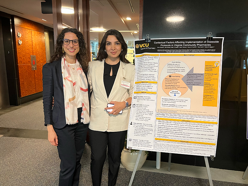 c p p i director, Teresa Salgado, and student stand with research poster.