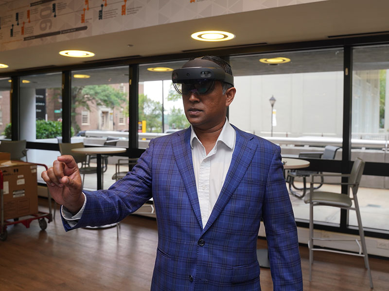 Professor wearing artificial intelligence goggles.